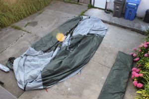 the fly is protected, the tent opens under it for rainy setups, the doors are ready to be used